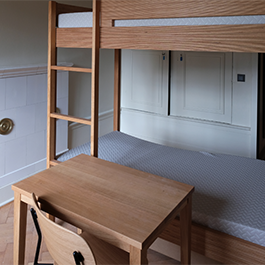 chateau dorm with bunk bed and desk