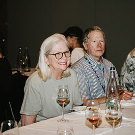 man and woman sipping wine at a tasting