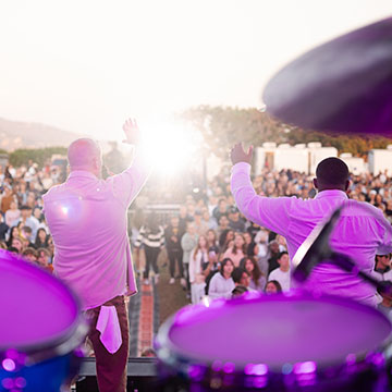 view of performers from behind with crowd