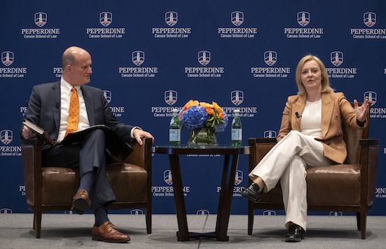President Jim Gash and Liz Truss