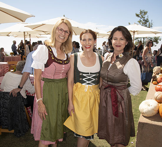 attendees dressed in traditional German clothes