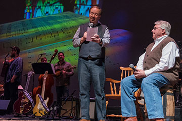 people on stage with live performance